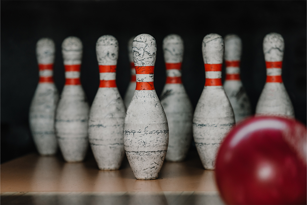 Bowling pins and a ball ready on the lane